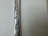 a spoon and fork sitting on a table