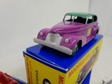 a toy car sitting on top of a box on a table