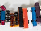a lot of toy trains that are lined up on the table