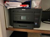 a printer that is sitting on top of a desk