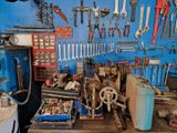 a workbench with many tools on it in a garage