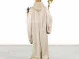 an image of a statue of a monk holding a staff