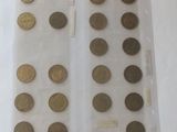 a lot of coins in a plastic bag on a table