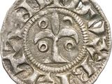 a silver coin with an image of a man ' s face on it