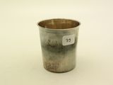 a small silver cup with a price tag on it
