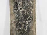 a black and white photo of a piece of art on a white surface