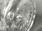 a clear glass vase sitting on top of a table