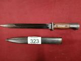 two knives are on a red surface with a price tag
