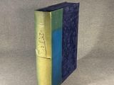 a blue and green book sitting on a table
