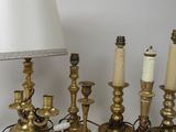 a lot of candles and a lamp on the table