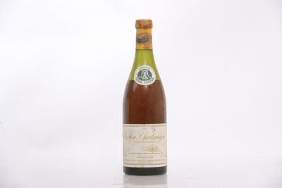 an image of a bottle of wine sitting on top of a table