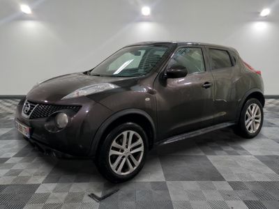 a picture of a nissan juke suv parked on a checkered floor