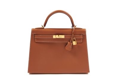 a brown leather handbag on a white background
