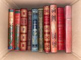 a box full of books that are sitting on a shelf