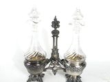 pair of antique silver plated decanters with glass vases