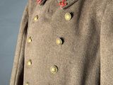 an image of a military coat with buttons on the collar