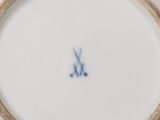 a white plate with a blue and white design on it