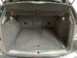 a trunk of a car with the back door open