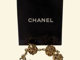 a close up of a box with a chain bracelet on it