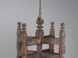 an image of a wooden chandelier hanging from a chain