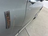 a sticker on the door of a car that has a sticker on it