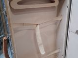 an open suitcase with a handle on the inside of it