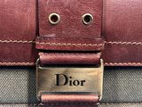a close up of a suitcase with a name tag on it