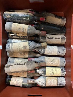 many bottles of wine in a box on the table