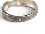 a close up of a ring on a white surface