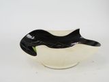 a black and white bowl with a fish design on it