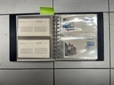 a binder that has a bunch of books inside of it