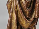 an antique statue of a man with a beard and a robe