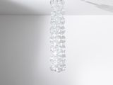a chandelier hanging from the ceiling in a room