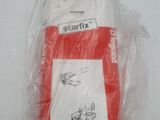 a red and white cell phone in a plastic bag