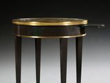 an image of a black and gold side table on a white surface