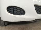 a close up of a car ' s front bumper and grille