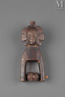 a close up of a wooden object with a bird on it