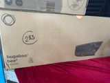 a cardboard box that is sitting on top of a bed