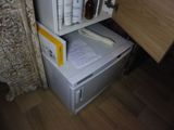 a small refrigerator with a lot of things on it