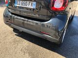 a small car that is parked on the side of the road