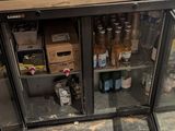 a glass case with bottles of wine on top of it