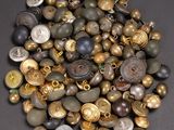 a pile of buttons that are sitting on a table