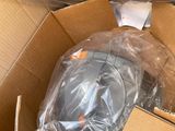 a cardboard box filled with a computer mouse and other items