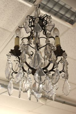 a chandelier hanging from the ceiling in a room