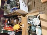 a box full of assorted items sitting on a kitchen counter