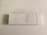 a piece of paper on a white plate with a toothbrush