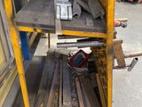 a metal shelf with a bunch of metal items on it