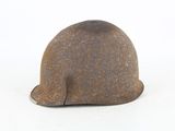 an old helmet that is sitting on a white surface