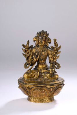 an image of a statue of a woman sitting on top of a bowl