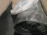 a roll of plastic wrap on top of a cardboard box